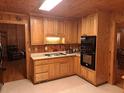 Cozy kitchen with wood cabinets and appliances at 7505 Hall Rd, Fairburn, GA 30213