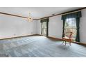 Bright dining room with carpet and large windows at 349 Asa Moseley Rd, Stockbridge, GA 30281