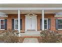 Elegant front entrance with columns and double doors at 349 Asa Moseley Rd, Stockbridge, GA 30281