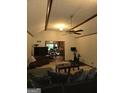 Living room with vaulted ceiling, a ceiling fan and view to dining area at 2531 Quentin Dr, Jonesboro, GA 30236