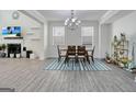 Elegant dining room with hardwood floors and a chandelier at 3290 Stock Saddle Pl, Cumming, GA 30040
