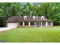 Brick ranch house with attached garage at 3110 Highway 20 W, Hampton, GA 30228