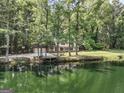 Ranch home on a pond with dock at 3110 Highway 20 W, Hampton, GA 30228