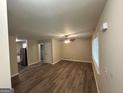 Spacious living room with vinyl flooring and a ceiling fan at 3207 Cloverhurst Dr, East Point, GA 30344
