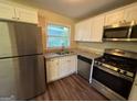 Updated kitchen with stainless steel appliances and granite countertops at 2213 Westover Dr, East Point, GA 30344