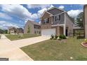 Two-story home with brick facade and a spacious driveway at 1705 Labonte Pkwy, Mcdonough, GA 30253