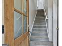 Entryway with wooden door and carpeted stairs at 520 Connally Se St, Atlanta, GA 30312