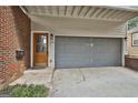 Gray garage with wooden door at 520 Connally Se St, Atlanta, GA 30312