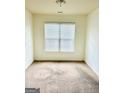Simple bedroom with neutral carpeting and window blinds at 700 Emporia Loop, Mcdonough, GA 30253