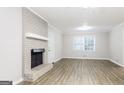 Living room with fireplace and hardwood floors at 7325 Czar Pl, Riverdale, GA 30296