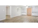 Dining room with built-in shelving and hardwood floors at 7325 Czar Pl, Riverdale, GA 30296