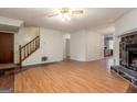 Living room with hardwood floors and fireplace at 602 Pine Tree Trl, College Park, GA 30349
