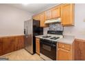 Kitchen with stainless steel appliances and wood cabinets at 602 Pine Tree Trl, College Park, GA 30349