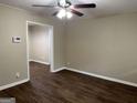 Living room with dark laminate flooring and neutral walls at 3188 Convair Ln, Decatur, GA 30032