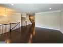 Open living area with hardwood floors and a staircase at 1656 Woodbridge Ne Ln, Atlanta, GA 30329