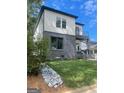 Modern two-story home with grey brick and white accents at 3419 Hamilton Ave, Hapeville, GA 30354
