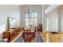 Elegant dining room with hardwood floors, large window, and charming wooden buffet at 1461 Hada Ln, Lawrenceville, GA 30043