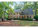 Two-story brick home with a welcoming front porch and landscaping at 270 Emerald Lake Dr, Fayetteville, GA 30215