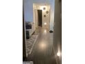 Bright hallway with wood-look flooring at 2734 Laurel View Dr, Snellville, GA 30039