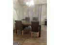 Dining room with dark wood table and gray chairs at 2734 Laurel View Dr, Snellville, GA 30039