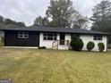 Charming ranch home with updated black and white exterior at 415 Crabapple Rd, Fayetteville, GA 30215