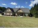 Ranch style home with a large front yard at 21 Water Oak Dr, Sharpsburg, GA 30277