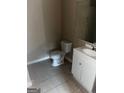 Simple bathroom with toilet, sink, and vanity at 1505 Camelot Dr, College Park, GA 30349