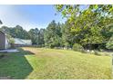 Large backyard with plenty of space for outdoor activities at 115 Worthy Dr, Mcdonough, GA 30252