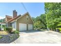 Two-car garage and large driveway at 115 Worthy Dr, Mcdonough, GA 30252