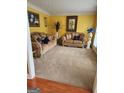 Spacious living room with two sofas and decorative accents at 1158 Folkstone Dr, Mcdonough, GA 30253
