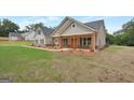 Charming house exterior with a covered porch and well-manicured lawn at 585 Highway 155 North N, Mcdonough, GA 30252