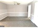 Bright living room featuring neutral walls and carpeting at 2914 Parc Lorraine, Stonecrest, GA 30038