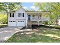 Two-story home with attached garage and front porch at 179 Runnell W Rd, Rockmart, GA 30153