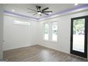 Bright living room with hardwood floors and access to backyard at 3299 Sims St, Hapeville, GA 30354
