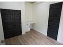 Home office with built-in desk and double doors at 3299 Sims St, Hapeville, GA 30354