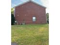 Red brick side of house, grassy area at 2237 Wind Rose Ct, Lithonia, GA 30058