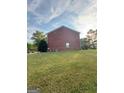 Brick building exterior with grassy yard at 2237 Wind Rose Ct, Lithonia, GA 30058