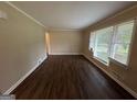 Spacious living room featuring hardwood floors and large windows at 2241 Sharon Way, Decatur, GA 30032