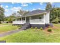 Renovated bungalow with gray siding and a porch at 26 Pool Woods Dr, Grantville, GA 30220