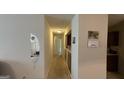 Long hallway with light walls and carpeted flooring at 5204 Waldrop Pl, Decatur, GA 30034