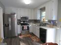 Kitchen with stainless steel appliances and white cabinets at 110 Gwenellen Dr, Locust Grove, GA 30248