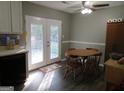 Dining area with table and chairs, and access to deck at 110 Gwenellen Dr, Locust Grove, GA 30248