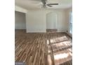 Spacious living room with hardwood floors and wainscoting at 4330 Cedar Valley Ln, Conley, GA 30288