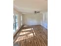 Large living room with hardwood floors and lots of natural light at 4330 Cedar Valley Ln, Conley, GA 30288
