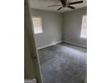 Spacious bedroom with ceiling fan and gray carpet at 1999 Lindsey Ln, Decatur, GA 30035