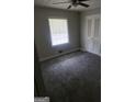 Bright bedroom with ceiling fan and gray carpet at 1999 Lindsey Ln, Decatur, GA 30035