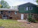 Brick house with patio and a grassy backyard at 4139 Northstrand Dr, Decatur, GA 30035
