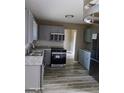Gray kitchen with stainless steel appliances and granite countertops at 4139 Northstrand Dr, Decatur, GA 30035