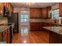 Spacious kitchen with granite countertops and wooden cabinets at 5447 Centry Dr, Villa Rica, GA 30180
