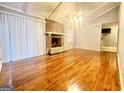 Living room with hardwood floors and fireplace at 1196 Burbank Trl, Morrow, GA 30260